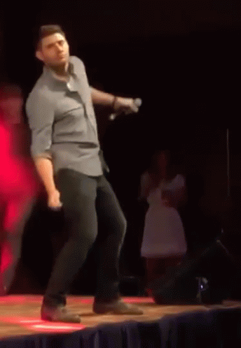 Man In Blue Shirt Dancing On Stage GIF