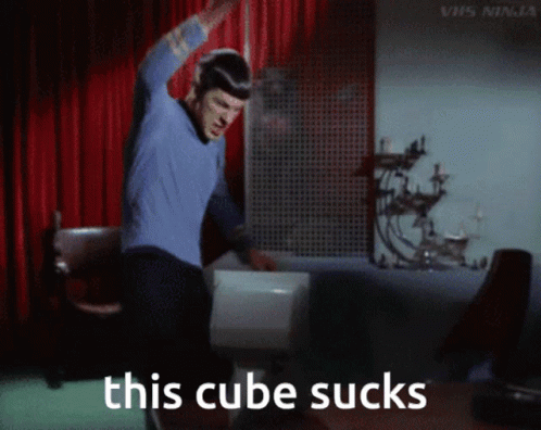 Man in Blue Shirt Dancing with Text This Cube Sucks