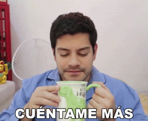 Man In Blue Shirt Drinking From Green Mug Cuentame Mas GIF