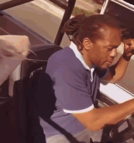 Man In Blue Shirt Driving Car GIF