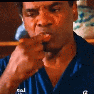 Man In Blue Shirt Eating Meat GIF