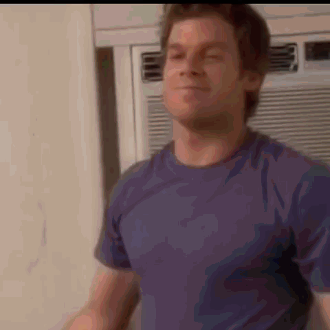 Man in Blue Shirt Eyes Closed by Air Conditioner