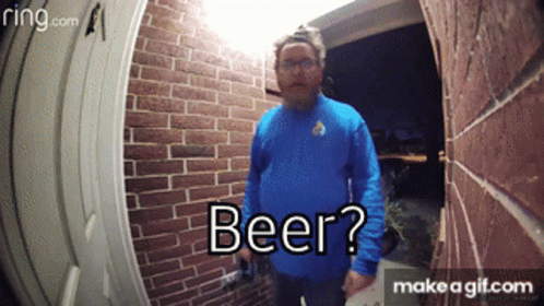 Man in Blue Shirt Holding Beer