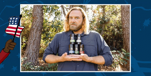 Man In Blue Shirt Holding Bottles With American Flag Hand GIF