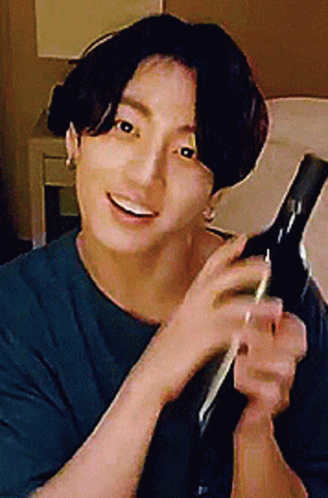 Man in Blue Shirt Holding Hair Dryer
