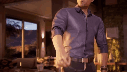 Man in Blue Shirt Holding Hand