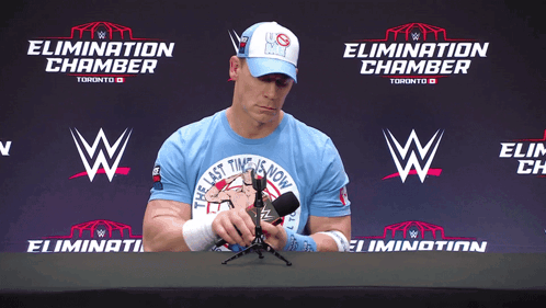 Man in Blue Shirt Holding Microphone
