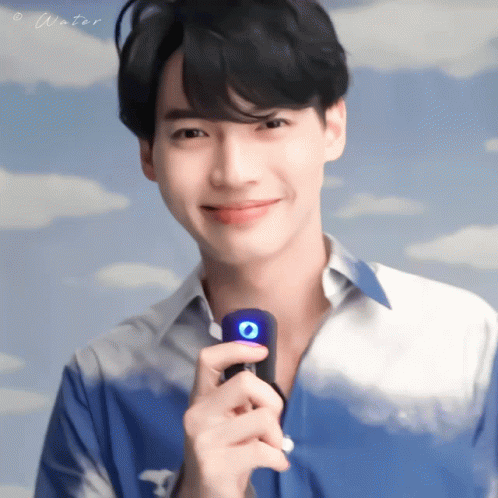 Man In Blue Shirt Holding Microphone Saying Water GIF