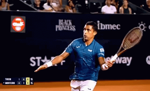 Man in Blue Shirt Holding Tennis Racquet Saying Black Princess