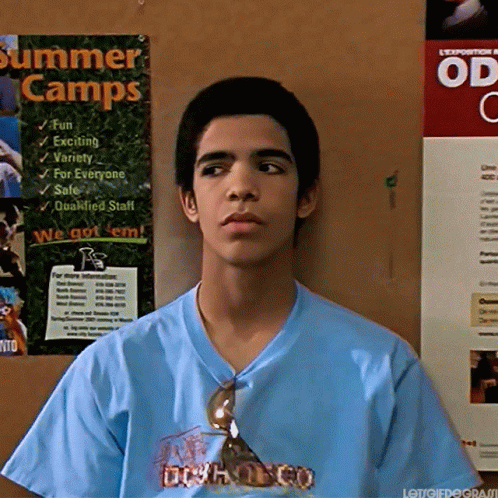 Man in Blue Shirt Holding Wood