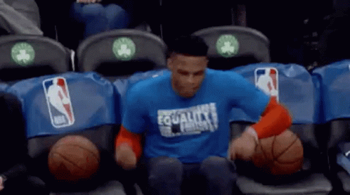 Man In Blue Shirt In Basketball Locker Room GIF