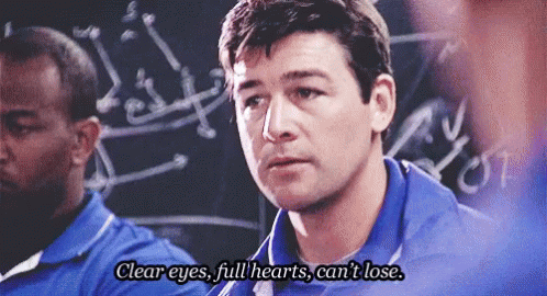 Man In Blue Shirt In Front Of Blackboard GIF