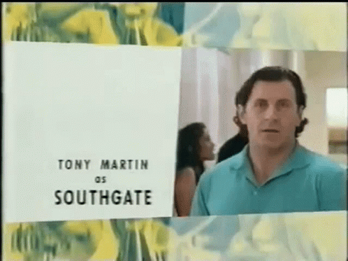 Man in Blue Shirt in Front of Tony Martin Southgate Sign
