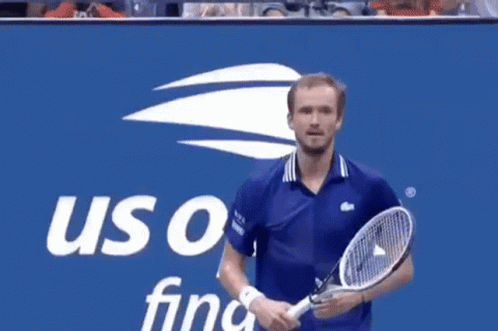 Man In Blue Shirt In Front Of US Open Final Sign GIF