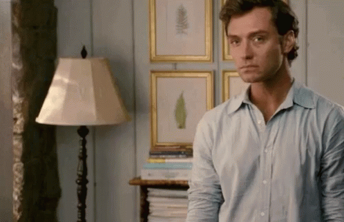 Man In Blue Shirt In Living Room GIF