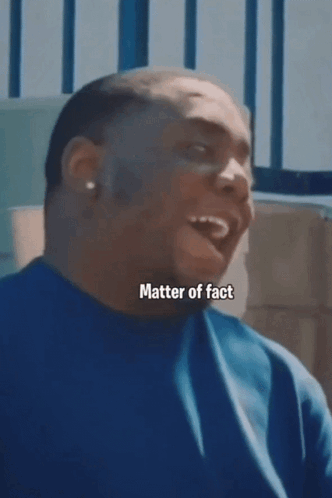 Man in Blue Shirt Laughing Matter of Fact