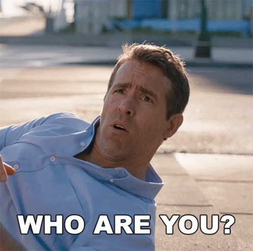 Man in Blue Shirt Laying Down With Who Are You