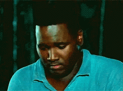 Man In Blue Shirt Looking Down Eyes Closed GIF