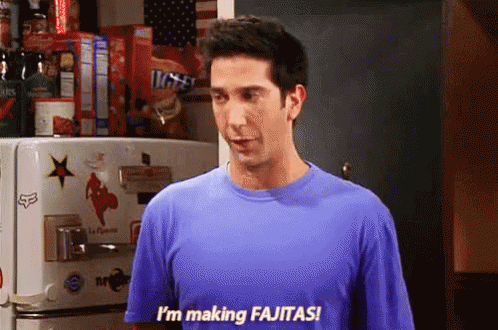Man In Blue Shirt Making Fajitas GIF