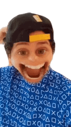 Man in Blue Shirt Making Funny Face