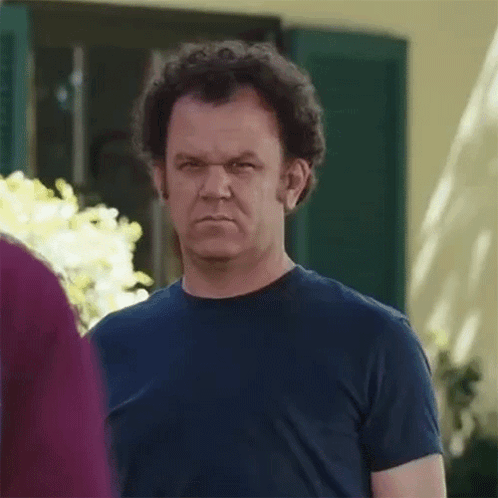 Man in Blue Shirt Making Funny Face
