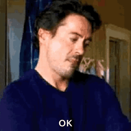 Man in Blue Shirt Making Funny Face