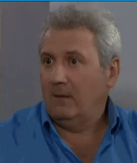 Man In Blue Shirt Making Funny Face GIF