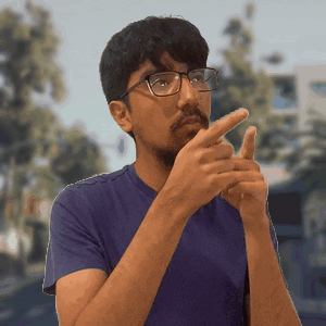 Man in Blue Shirt Making Gesture