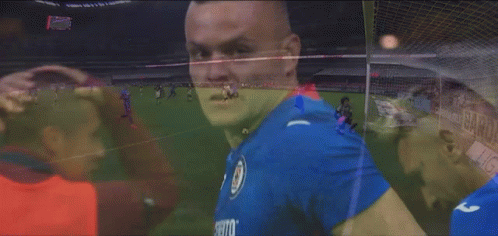 Man in Blue Shirt Making Heart