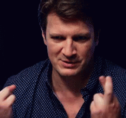 Man In Blue Shirt Making Middle Finger Gesture GIF