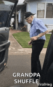 Man In Blue Shirt Next To Car GIF