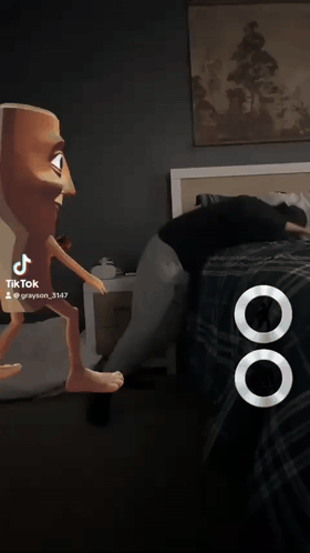 Man In Blue Shirt Next To Cartoon Character With Fist GIF