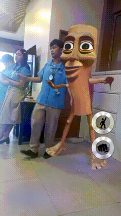 Man In Blue Shirt Next To Cartoon Character With Fist On Floor GIF