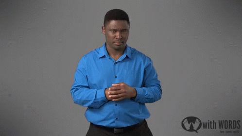 Man In Blue Shirt Next To Sign With Words GIF