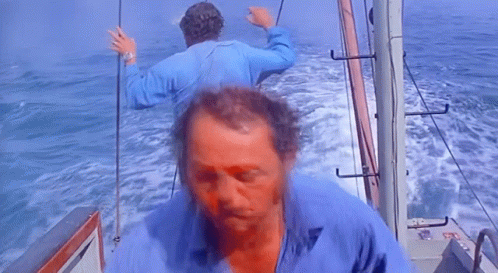 Man in Blue Shirt on Boat