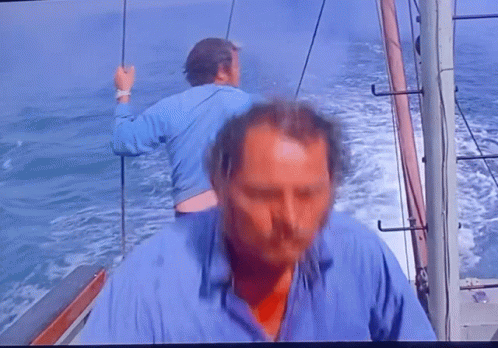 Man in Blue Shirt on Boat