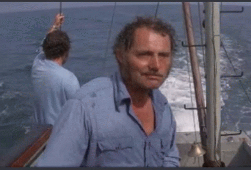 Man in Blue Shirt on Boat