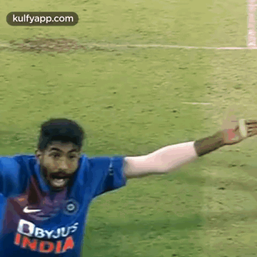 Man in Blue Shirt on Soccer Field