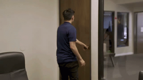 Man In Blue Shirt Opening Door GIF