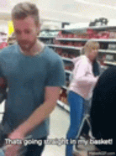 Man In Blue Shirt Pushing Shopping Cart GIF