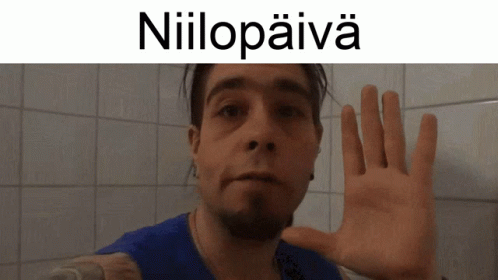Man in Blue Shirt Raising Hand Niilopaiva