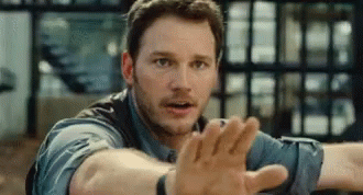 Man in Blue Shirt Reaching Out
