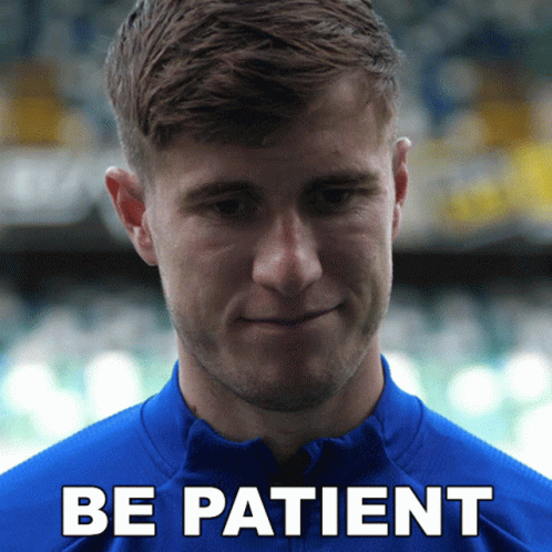 Man In Blue Shirt Saying Be Patient GIF