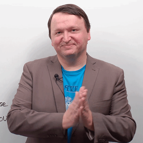 Man in Blue Shirt Saying Five Clapping