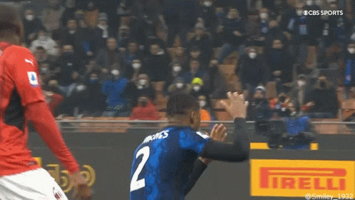 Man in Blue Shirt Saying Football