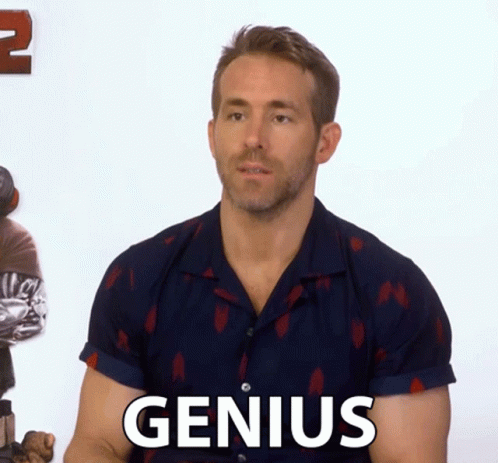 Man in Blue Shirt Saying Genius