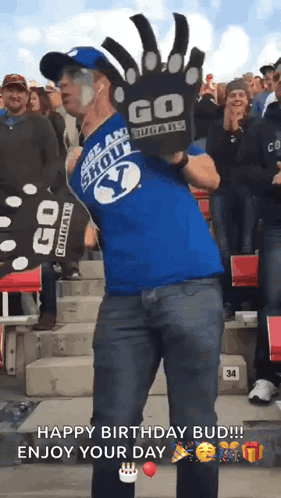 Man in Blue Shirt Saying Go Cougars Dancing