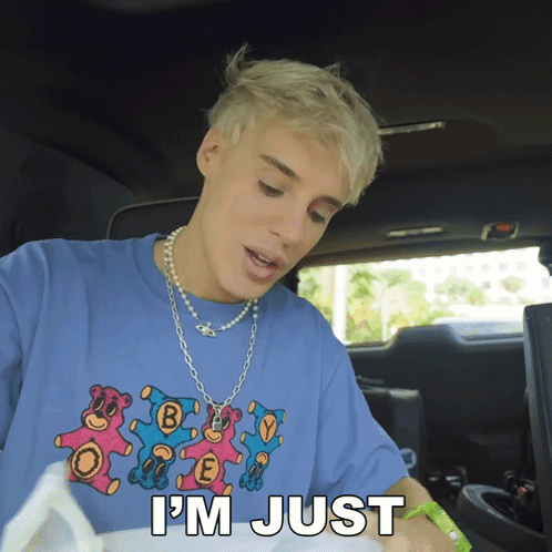 Man in Blue Shirt Saying Im Just