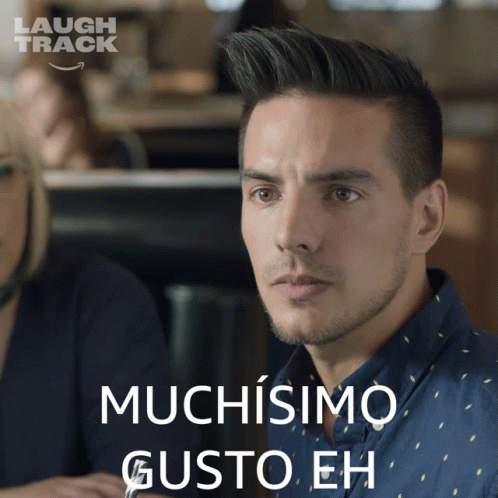 Man In Blue Shirt Saying Muchisimo GIF