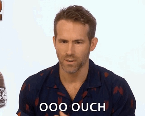 Man in Blue Shirt Saying Ouch